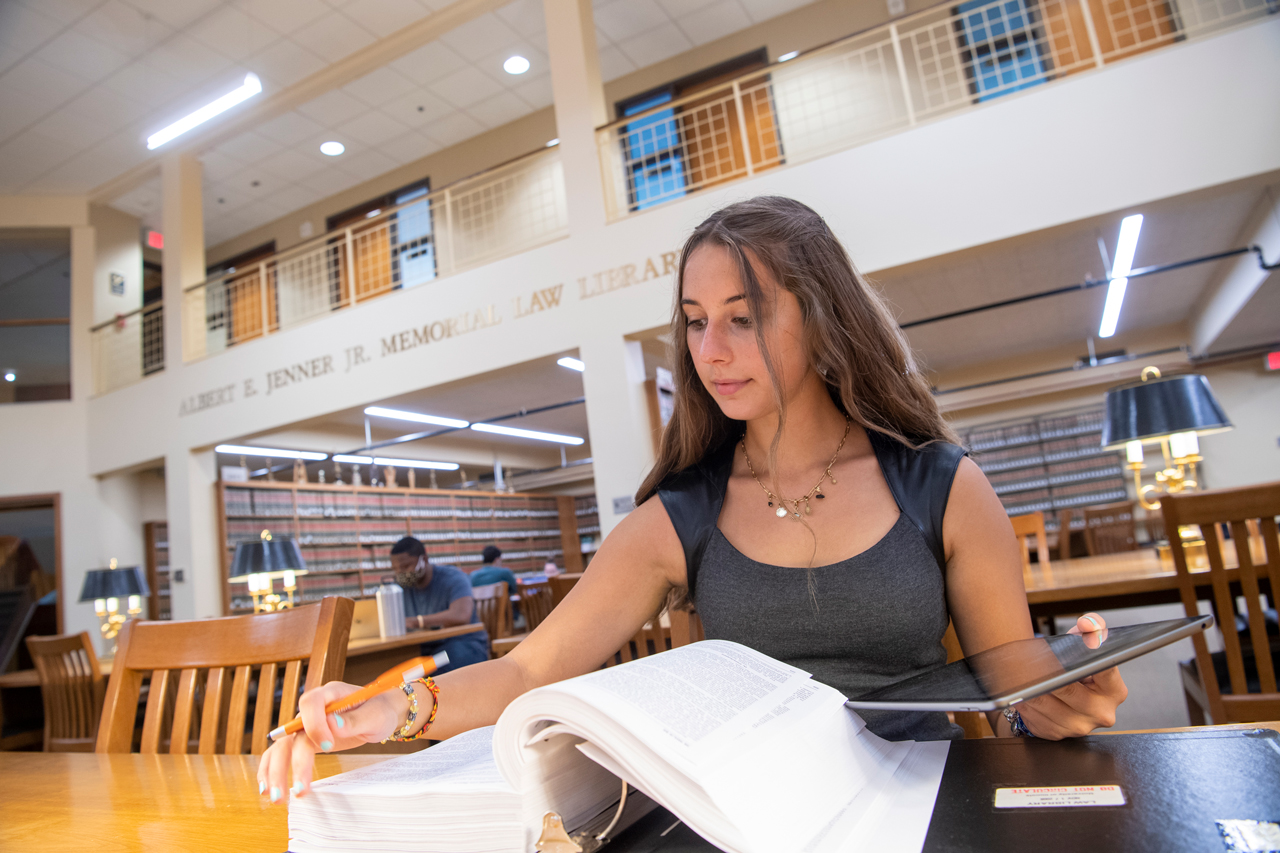 Student studying in Law School library.