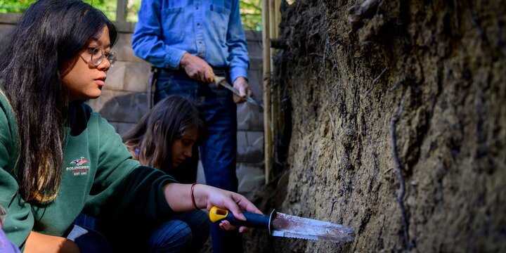 Student anlayzing soil pit
