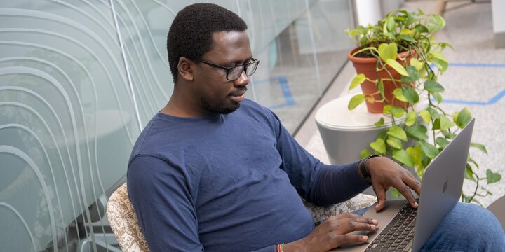 Student sitting working on a computer
