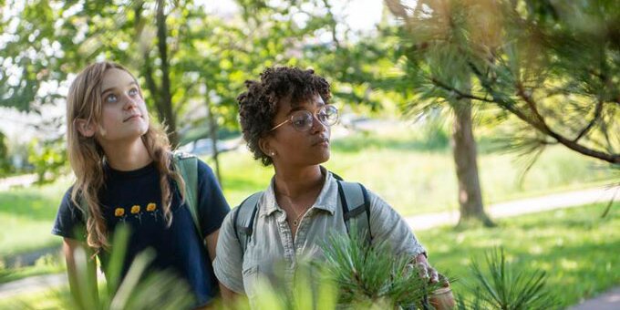 Two students looking at trees